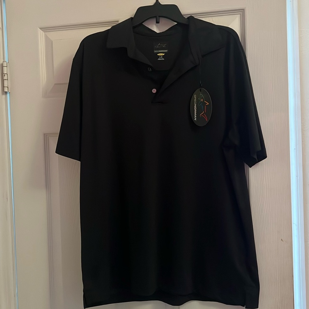 Greg Norman golf shirt.